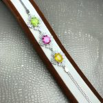 دستبند سه نگین زبرجد و توپاز صورتی و یاقوت زرد اصل